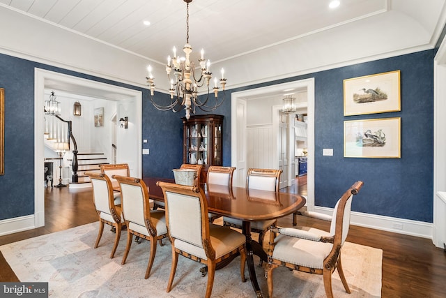 6529 Sothoron Rd, Mclean, VA 22101 - dining space featuring a chandelier, wood finished floors, stairs, baseboards, and crown molding