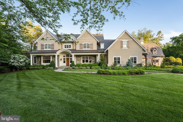 6529 Sothoron Rd, Mclean, VA 22101 - view of front of house featuring a standing seam roof, a front lawn, and stone siding