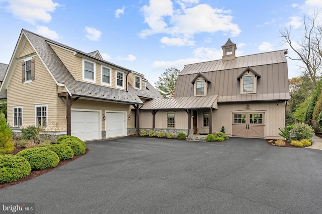 6529 Sothoron Rd, Mclean, VA 22101 - colonial inspired home featuring driveway, a standing seam roof, a garage, and metal roof