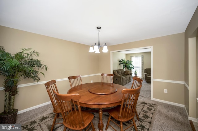 24 Cross Cut Ln, Fredericksburg, VA 22405 - dining area featuring a chandelier, light colored carpet, and baseboards