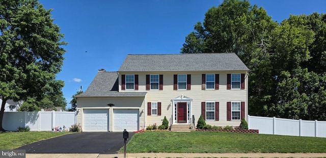 24 Cross Cut Ln, Fredericksburg, VA 22405 - colonial house with driveway, an attached garage, a chimney, and a shingled roof