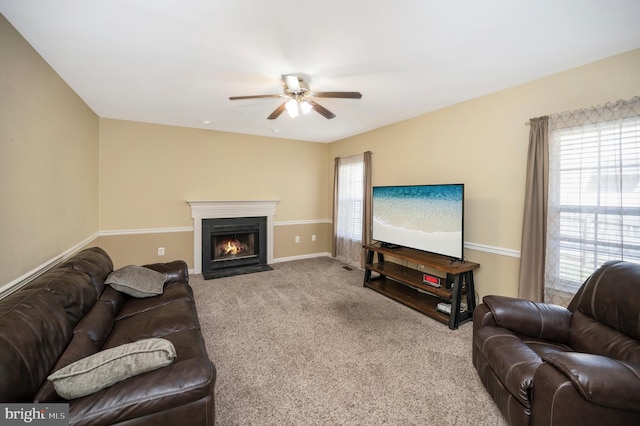 24 Cross Cut Ln, Fredericksburg, VA 22405 - carpeted living room featuring ceiling fan, plenty of natural light, a fireplace with flush hearth, and baseboards