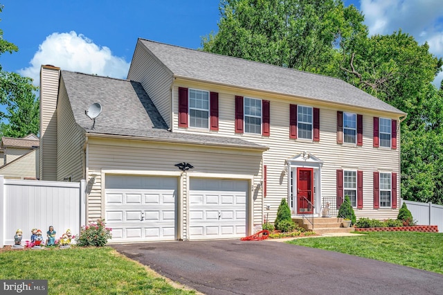 24 Cross Cut Ln, Fredericksburg, VA 22405 - colonial home with asphalt driveway, a garage, and a chimney