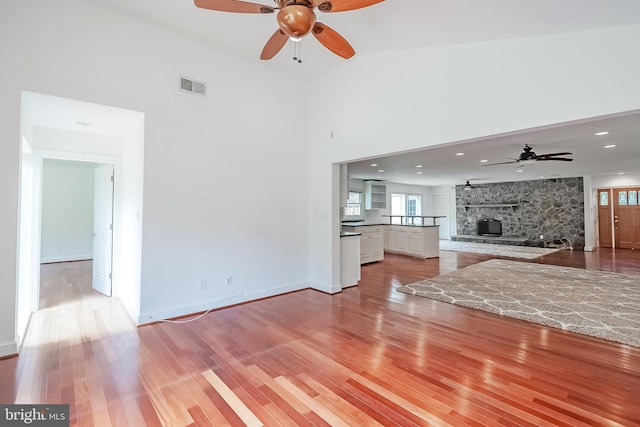 5923 Westridge Ct, Alexandria, VA 22310 - unfurnished living room featuring ceiling fan, plenty of natural light, light wood-type flooring, a towering ceiling, and recessed lighting