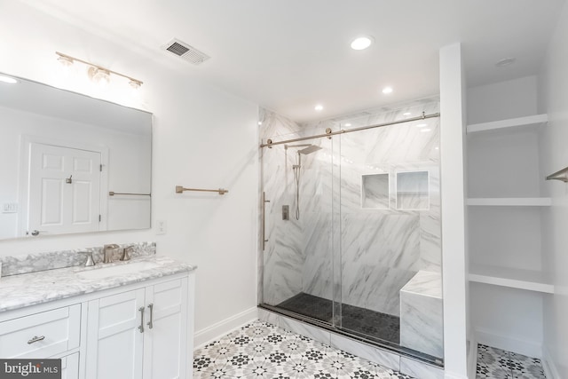 5923 Westridge Ct, Alexandria, VA 22310 - bathroom featuring a marble finish shower, vanity, baseboards, and recessed lighting