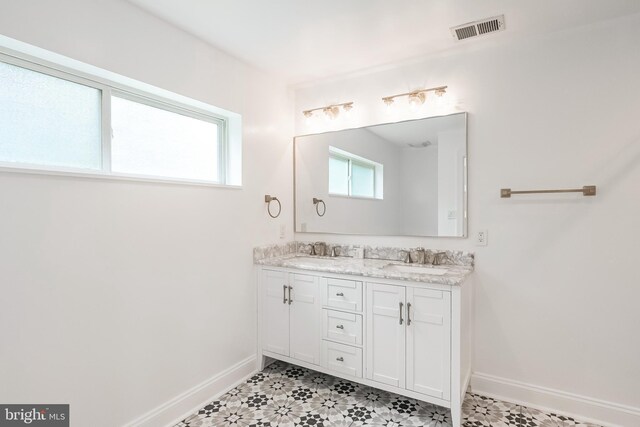 5923 Westridge Ct, Alexandria, VA 22310 - bathroom featuring baseboards, healthy amount of natural light, and double vanity