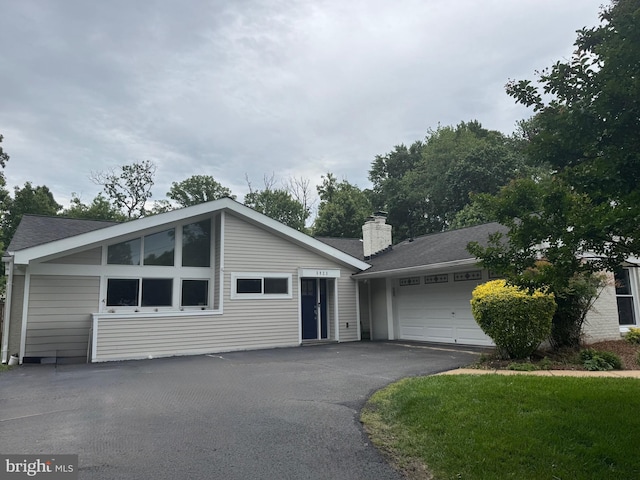 5923 Westridge Ct, Alexandria, VA 22310 - view of front of property with driveway, a chimney, and a garage