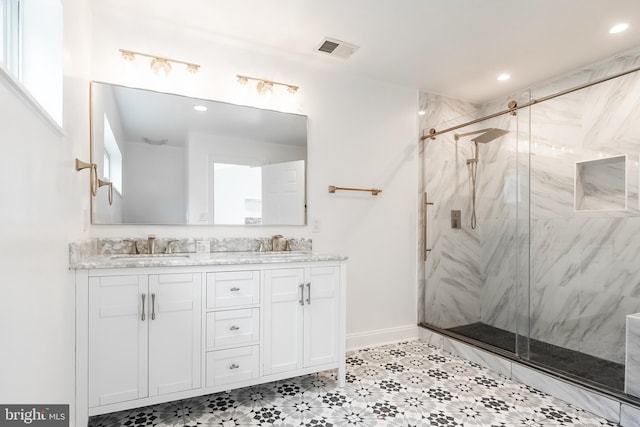 5923 Westridge Ct, Alexandria, VA 22310 - full bath featuring a marble finish shower, double vanity, recessed lighting, and baseboards