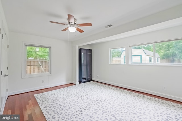 5923 Westridge Ct, Alexandria, VA 22310 - empty room with wood finished floors, ceiling fan, and baseboards