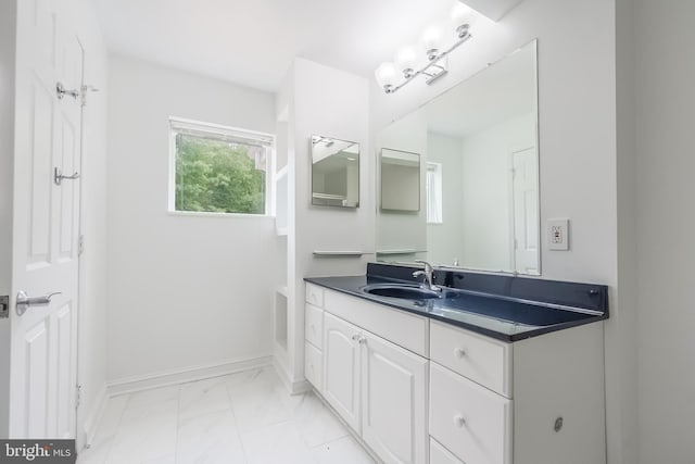 5923 Westridge Ct, Alexandria, VA 22310 - bathroom with vanity, baseboards, and marble look tile flooring