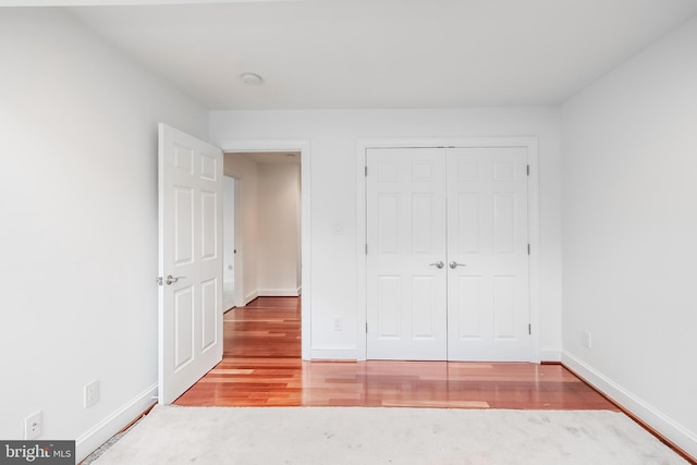 5923 Westridge Ct, Alexandria, VA 22310 - unfurnished bedroom with wood finished floors, baseboards, and a closet