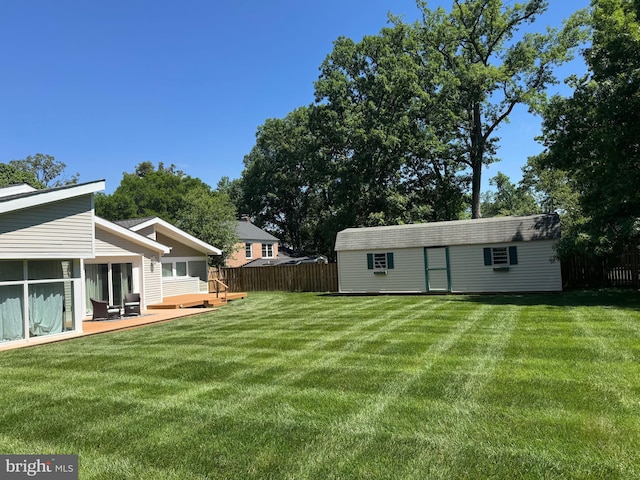 5923 Westridge Ct, Alexandria, VA 22310 - view of yard with an outbuilding, a sunroom, and a deck