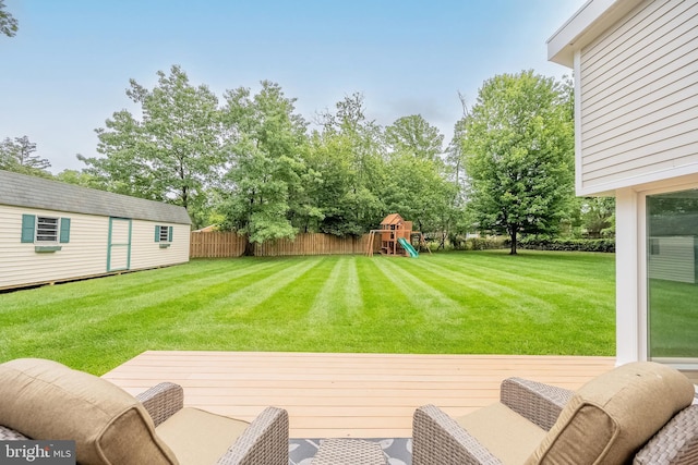 5923 Westridge Ct, Alexandria, VA 22310 - view of yard with a playground, a deck, and an outbuilding