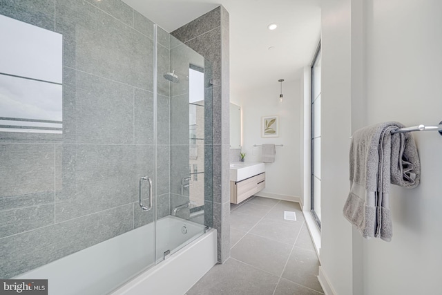 2907 Newark St NW, Washington, DC 20008 - full bath with tile patterned flooring, vanity, baseboards, and shower / bath combination with glass door