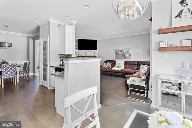 14 Barclay Ct, Bordentown, NJ 08505 - kitchen with a chandelier, dark wood-style flooring, white cabinetry, crown molding, and light stone counters