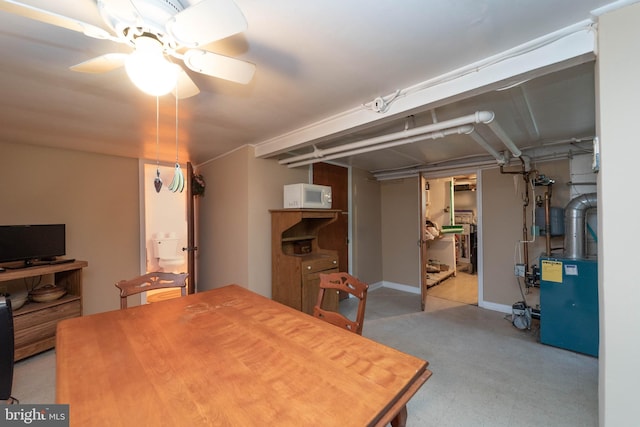555 Riverside Dr, Pasadena, MD 21122 - dining room featuring a heating unit, ceiling fan, and tile patterned floors