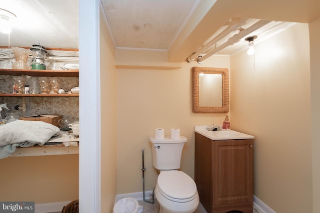555 Riverside Dr, Pasadena, MD 21122 - bathroom featuring toilet, vanity, ornamental molding, and baseboards