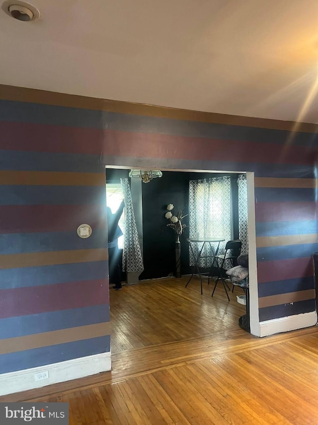 foyer featuring hardwood / wood-style floors and wood walls
