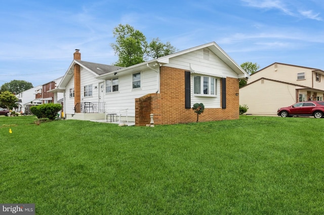 6402 Browning Rd, Pennsauken, NJ 08109 - view of side of home featuring a chimney, a lawn, and brick siding