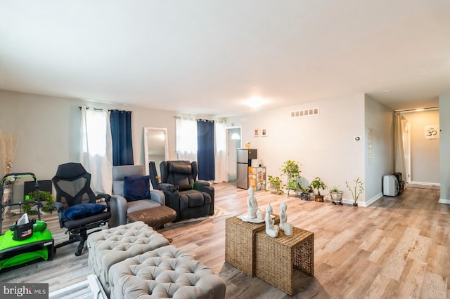 6402 Browning Rd, Pennsauken, NJ 08109 - living area with healthy amount of natural light and light wood finished floors
