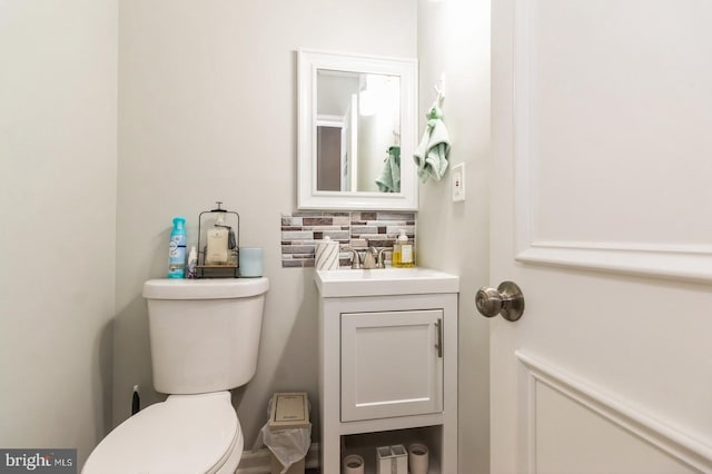 6402 Browning Rd, Pennsauken, NJ 08109 - half bathroom featuring vanity, toilet, and tasteful backsplash