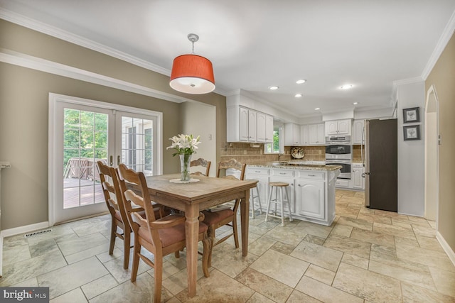 981 Old Holly Dr, Great Falls, VA 22066 - dining space featuring healthy amount of natural light, baseboards, crown molding, recessed lighting, and stone tile floors
