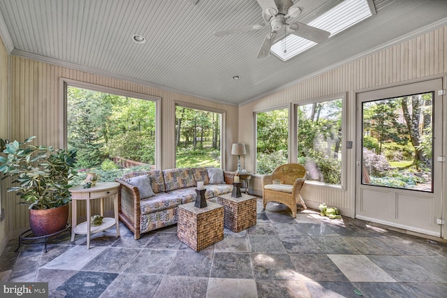 981 Old Holly Dr, Great Falls, VA 22066 - sunroom / solarium with lofted ceiling, ornamental molding, a skylight, plenty of natural light, and stone tile floors