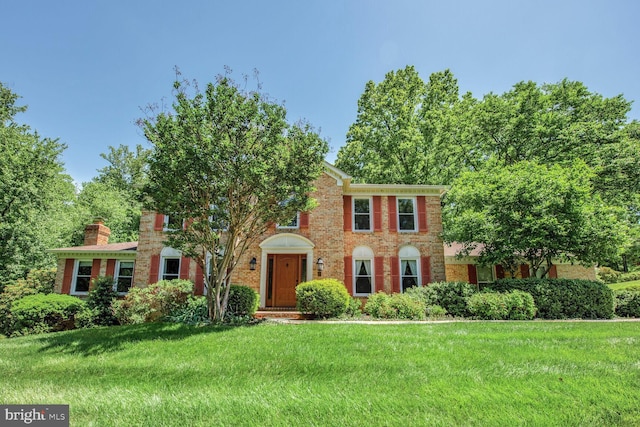981 Old Holly Dr, Great Falls, VA 22066 - view of front of property featuring a front yard and brick siding