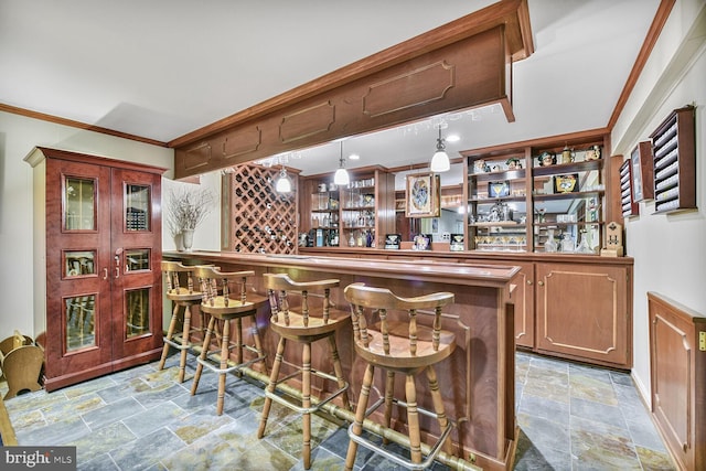 981 Old Holly Dr, Great Falls, VA 22066 - indoor bar with stone finish flooring, ornamental molding, hanging light fixtures, and baseboards