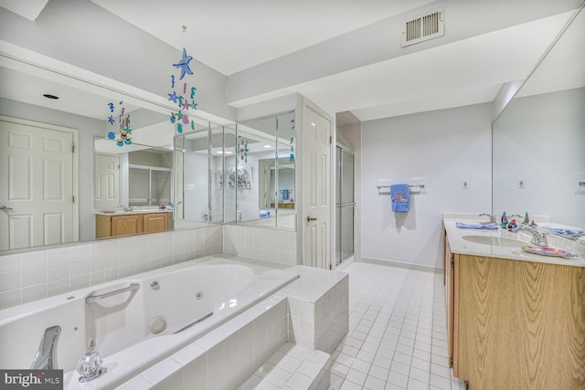 981 Old Holly Dr, Great Falls, VA 22066 - full bath featuring double vanity, a tub with jets, a shower stall, and tile patterned floors