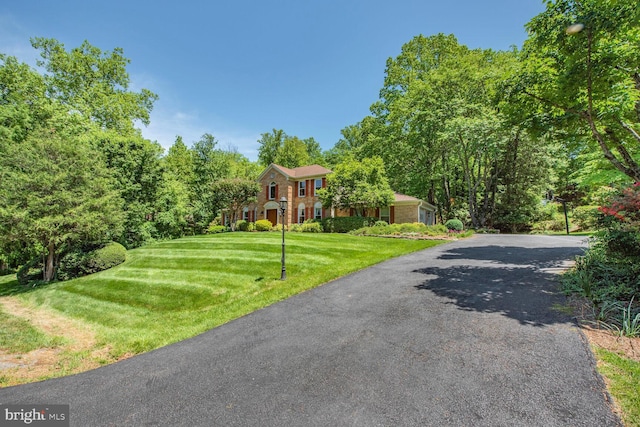 981 Old Holly Dr, Great Falls, VA 22066 - colonial inspired home with a front yard and driveway