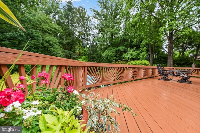 981 Old Holly Dr, Great Falls, VA 22066 - deck with outdoor dining space and view of scattered trees