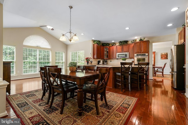 128 Bay Club Pkwy, North East, MD 21901 - dining room with dark wood-type flooring, a chandelier, lofted ceiling, and recessed lighting