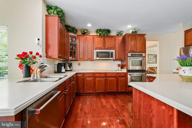 128 Bay Club Pkwy, North East, MD 21901 - kitchen with appliances with stainless steel finishes, a sink, dark wood-style flooring, light countertops, and recessed lighting