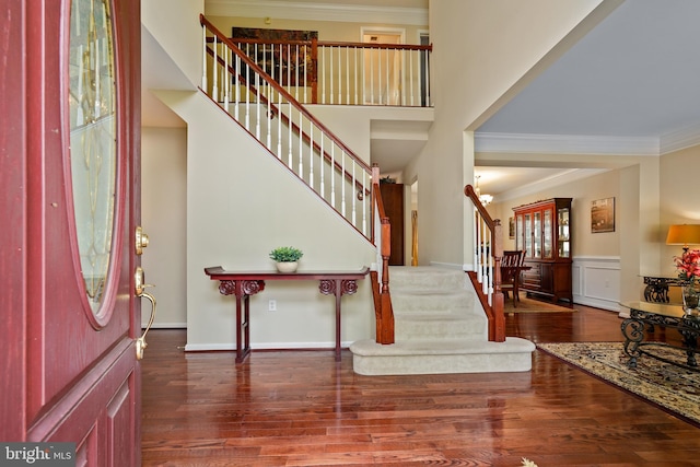 128 Bay Club Pkwy, North East, MD 21901 - entrance foyer featuring stairs, ornamental molding, wood finished floors, and a wainscoted wall
