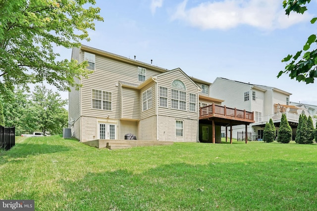 128 Bay Club Pkwy, North East, MD 21901 - rear view of property featuring a lawn, cooling unit, brick siding, and a deck