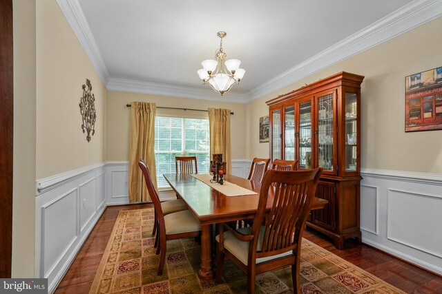 128 Bay Club Pkwy, North East, MD 21901 - dining room with a chandelier, wood finished floors, crown molding, wainscoting, and a decorative wall
