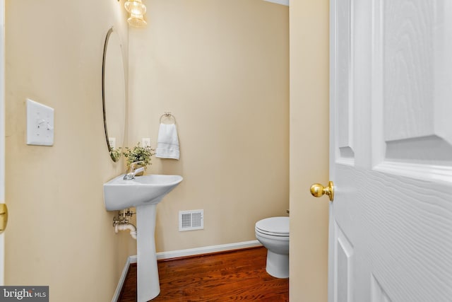 128 Bay Club Pkwy, North East, MD 21901 - bathroom featuring toilet, wood finished floors, and baseboards