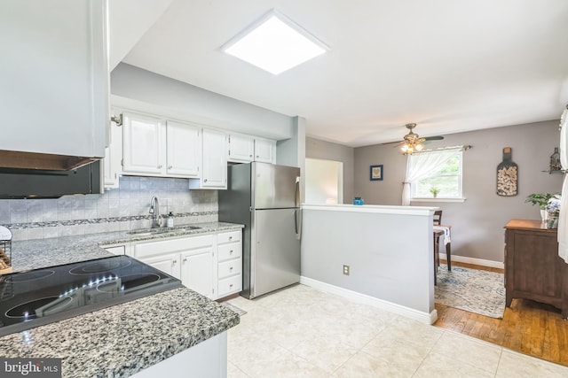 241 Fenwick Rd, Woodstown, NJ 08098 - kitchen with freestanding refrigerator, a sink, tasteful backsplash, white cabinetry, and ceiling fan