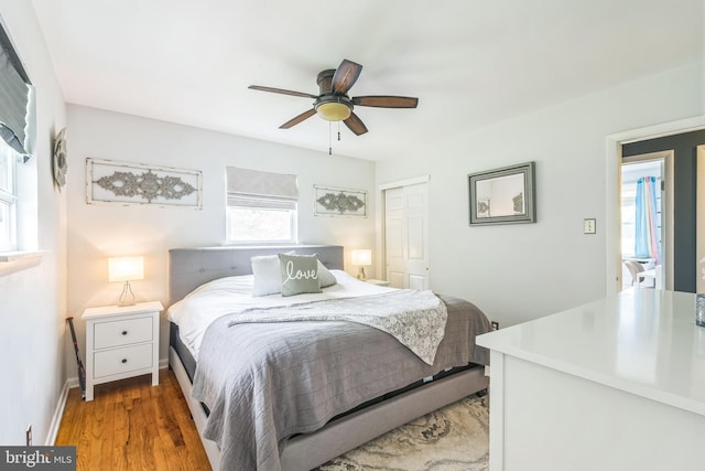 241 Fenwick Rd, Woodstown, NJ 08098 - bedroom with a closet, wood finished floors, a ceiling fan, and baseboards