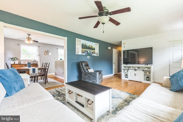 241 Fenwick Rd, Woodstown, NJ 08098 - living area with a ceiling fan, wood finished floors, and baseboards