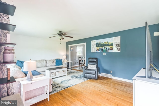 241 Fenwick Rd, Woodstown, NJ 08098 - living area with a ceiling fan, wood finished floors, and baseboards