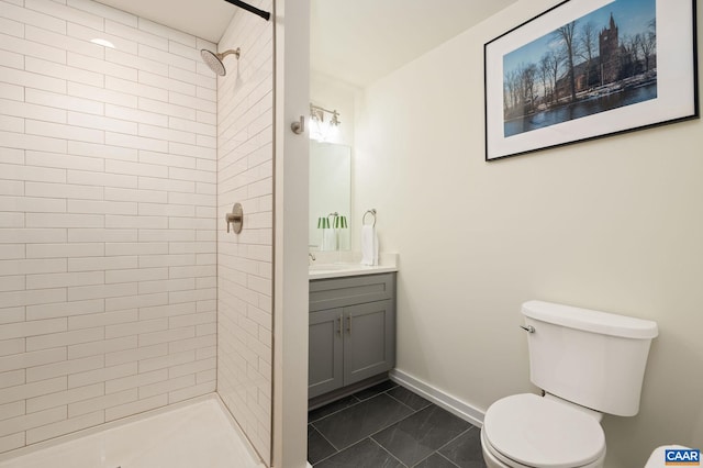 1638 Rialto St, Charlottesville, VA 22902 - full bath featuring toilet, tiled shower, vanity, tile patterned flooring, and baseboards