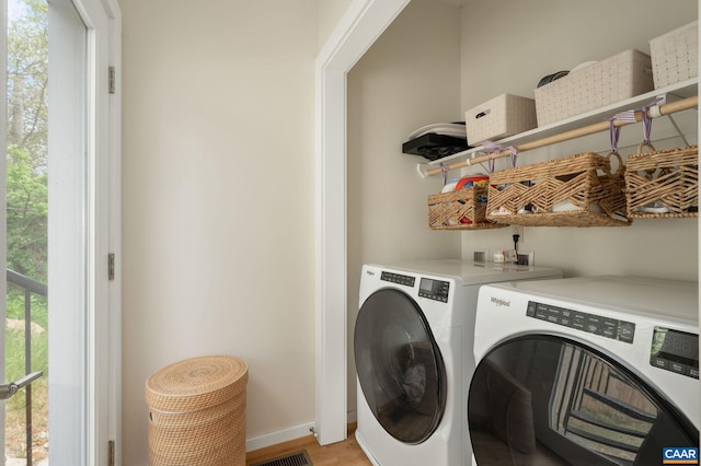 1638 Rialto St, Charlottesville, VA 22902 - washroom featuring independent washer and dryer, light wood-style flooring, and baseboards