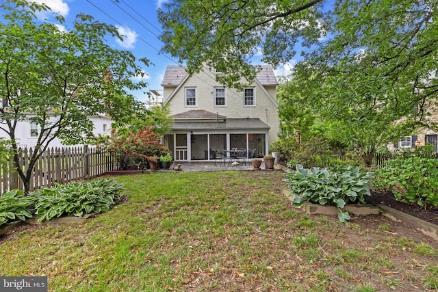 4404 Eastway, Baltimore, MD 21218 - back of property featuring a sunroom, roof with shingles, and stucco siding