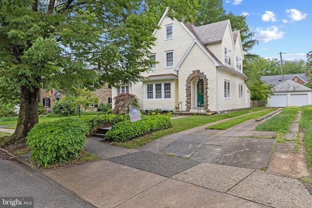 4404 Eastway, Baltimore, MD 21218 - view of front of house with stucco siding, a garage, and stone siding