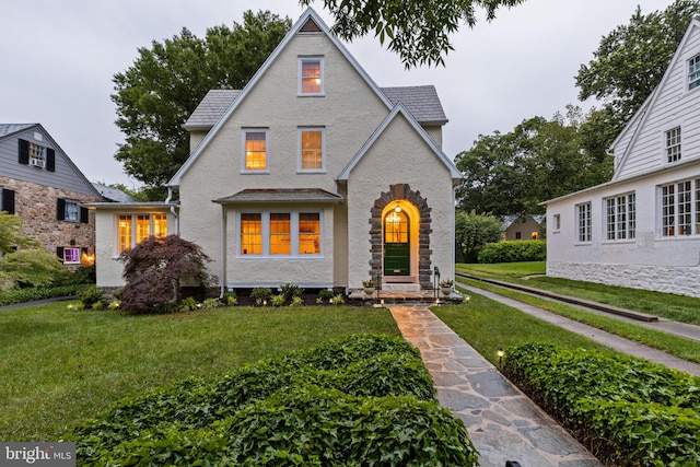 4404 Eastway, Baltimore, MD 21218 - view of front facade featuring a front lawn and stucco siding
