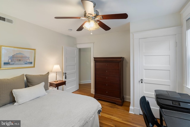 4404 Eastway, Baltimore, MD 21218 - bedroom featuring wood finished floors, baseboards, and a ceiling fan
