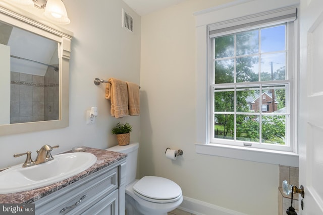 4404 Eastway, Baltimore, MD 21218 - bathroom with toilet, vanity, and a shower