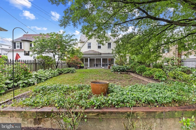 4404 Eastway, Baltimore, MD 21218 - view of yard featuring a vegetable garden and a sunroom
